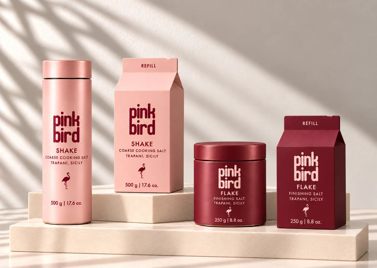 Concept render of Shake and Flake bottles with their matching refill cartons on smooth cream stone plinths.